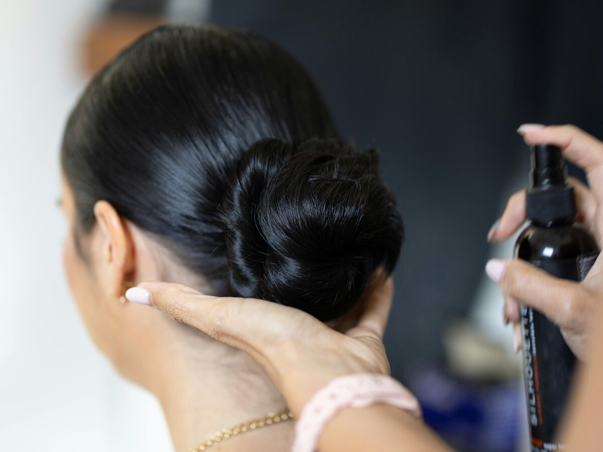 Low polished bun hairstyle from behind