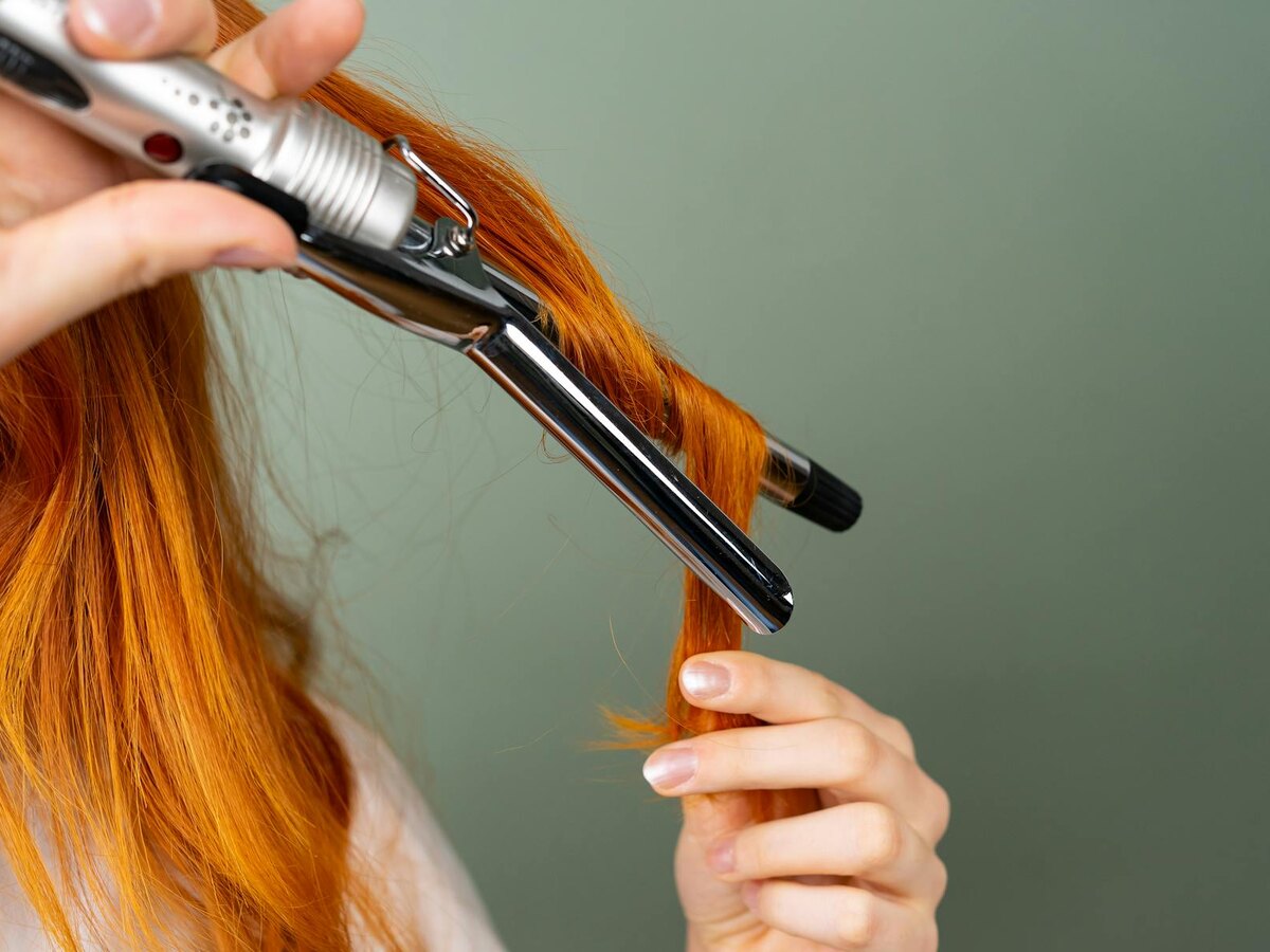 Styling copper hair with a curling iron